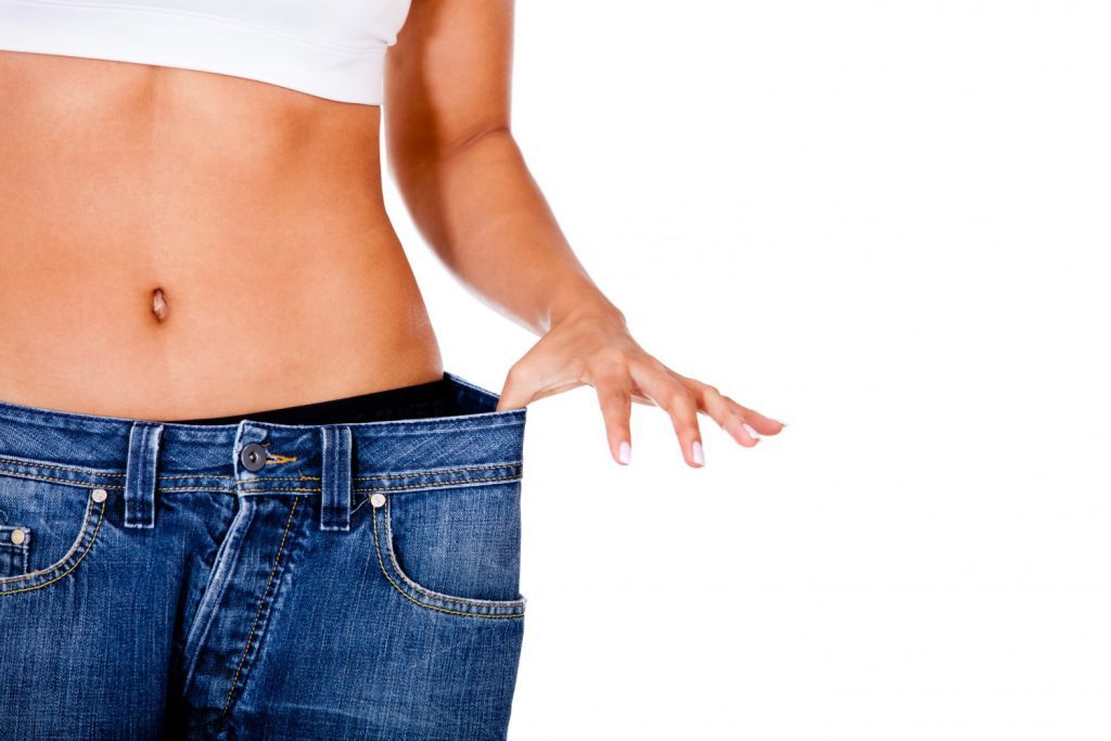 Thin woman in big pants - weight loss concepts