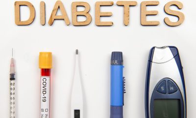 Top view of flat lay of medical supplies for the treatment of the patient - with de word diabetes in a white background