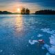 beautiful landscape of sunrise over frozen lake
